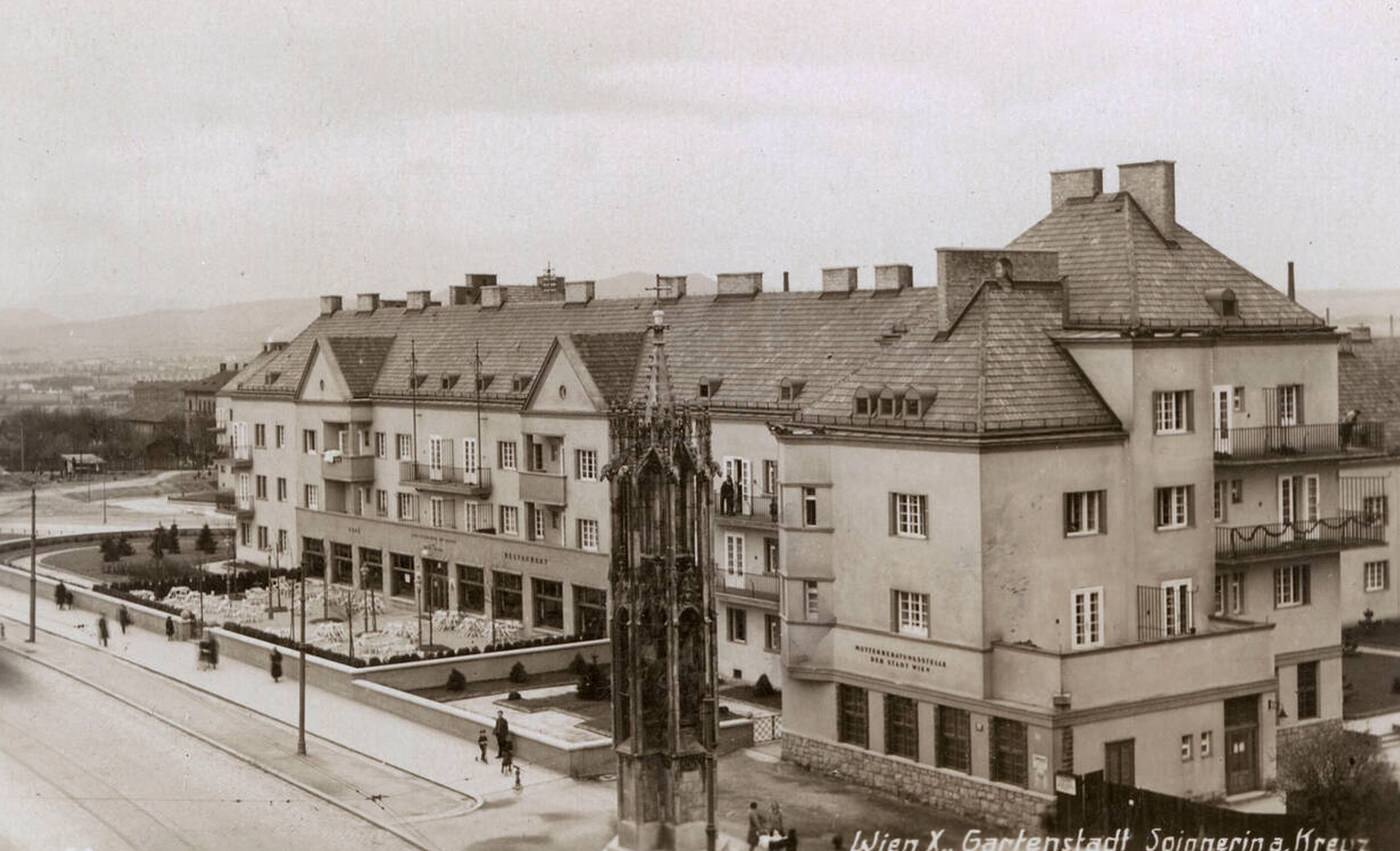 Garden city area with a gothic cross, Vienna, Austria.
