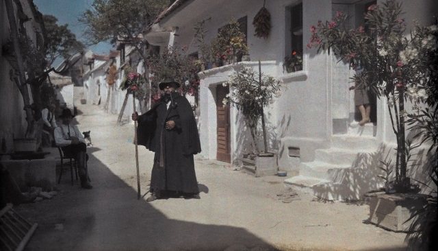 The night watchman of Morbisch am See standing in the street, Austria, 1929.