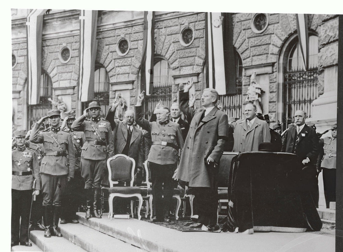 Chancellor Kurt Schuschnigg saluting during a parade in Vienna.