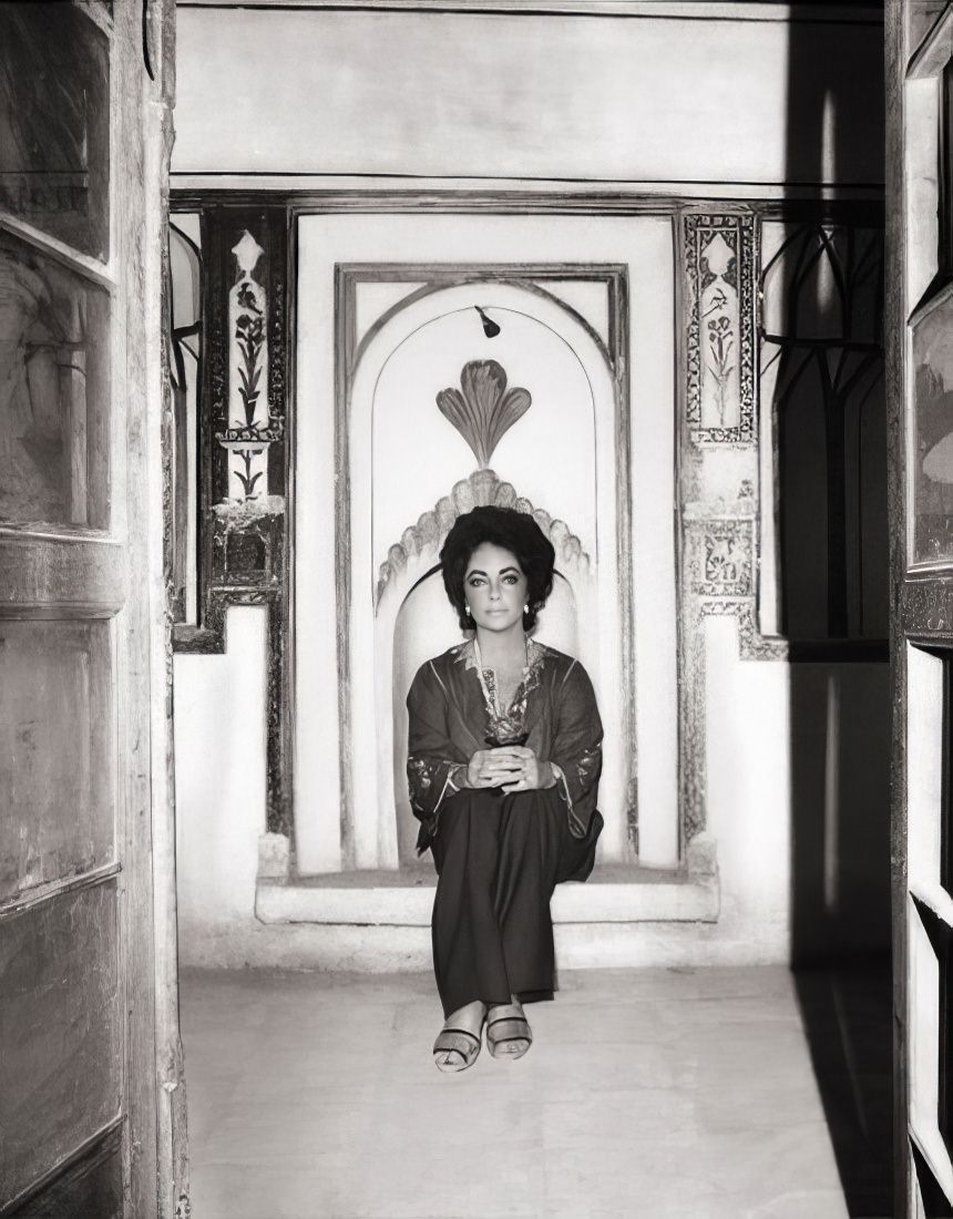 A close-up of Taylor outside a Shiraz mosque, framed by architectural elements