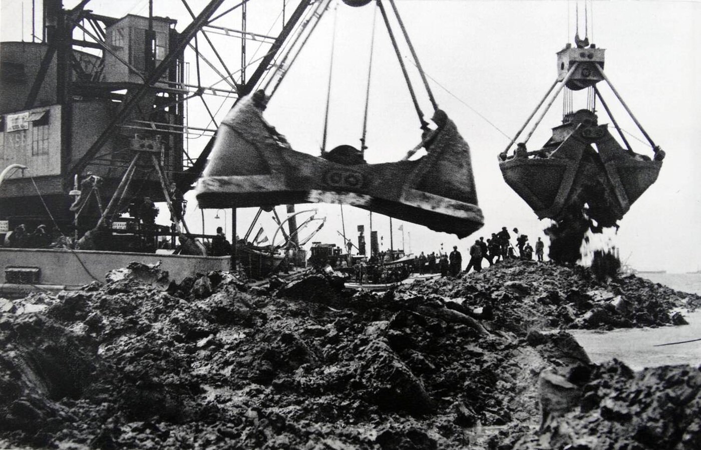 Dredging silt to create a dam in Holland, 1932.
