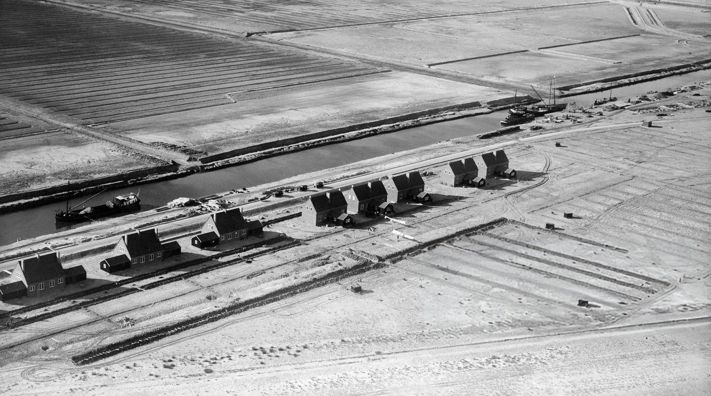 Holland The draining of the Zuiderzee, aerial view of the first buildings and canal, 1932.