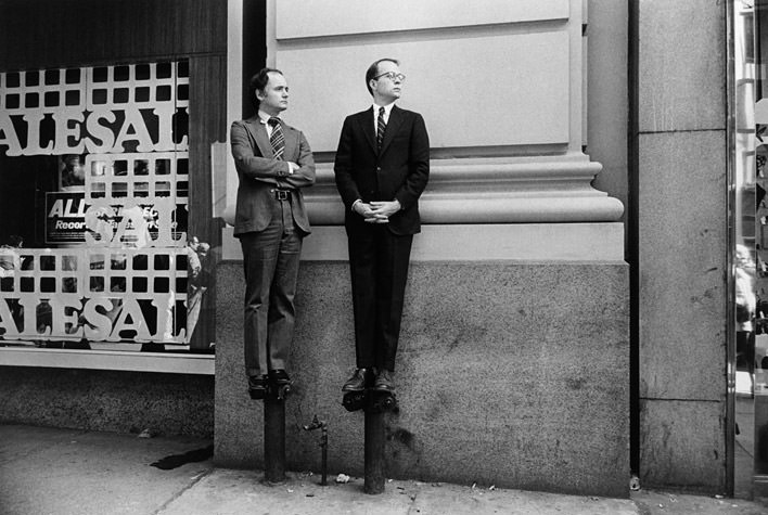 Two Men on Stand Pipes Watching Parade, 1975
