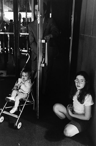 Doorway with Man, Baby in Stroller, and Girl, 1973