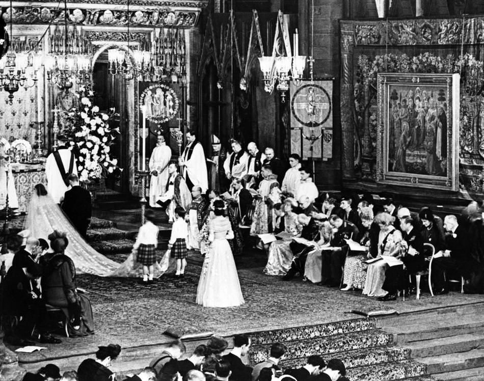 Britain's Princess Elizabeth and the Duke of Edinburgh kneel before the altar as they are blessed by the Archbishop of Canterbury, Dr. Geoffrey Fisher, following their wedding service in Westminster Abbey, London, on Nov. 20, 1947.