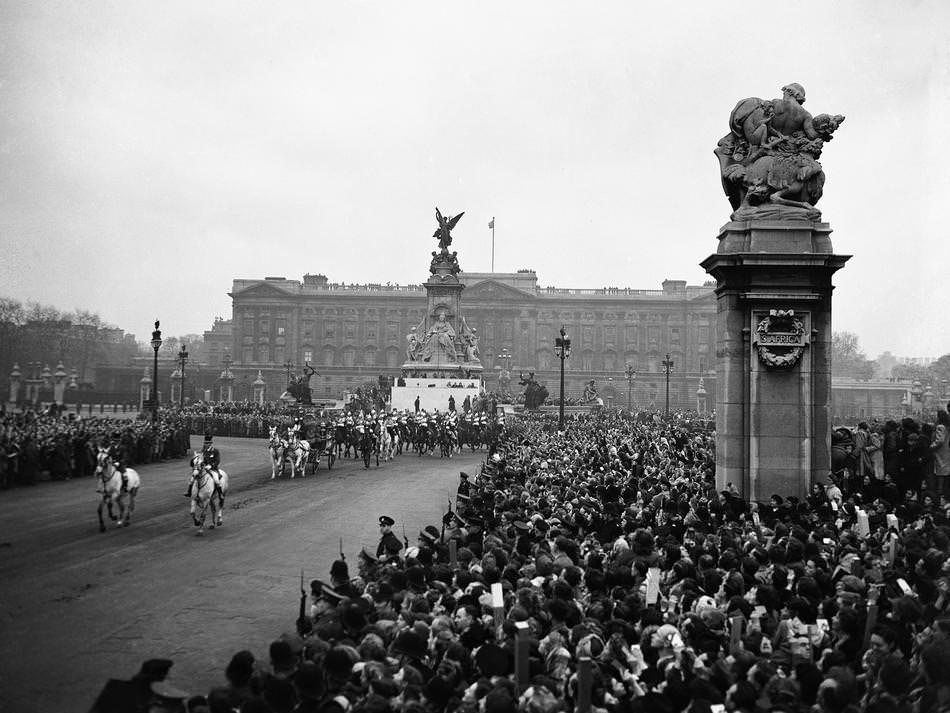The bridal procession, with the sovereign's escort of Household Cavalry, is seen leaving Buckingham Palace in London for Westminster Abbey on Nov. 20, 1947.