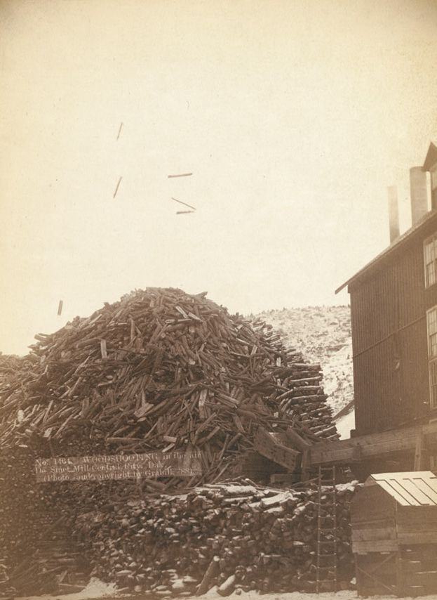 Wood shooting in the air at De Smet Mill, Center City, Dakota, 1888.