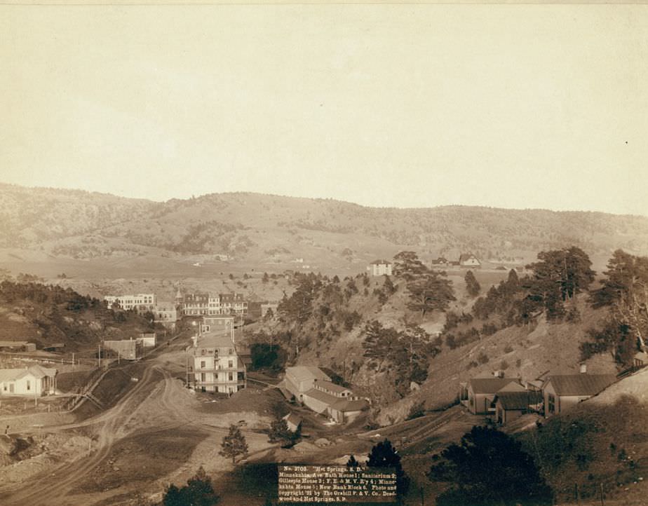 Hot Springs, South Dakota: Minnekahta Ave. Bath house, Sanitarium, Gillespie House, and New bank block, 1891.