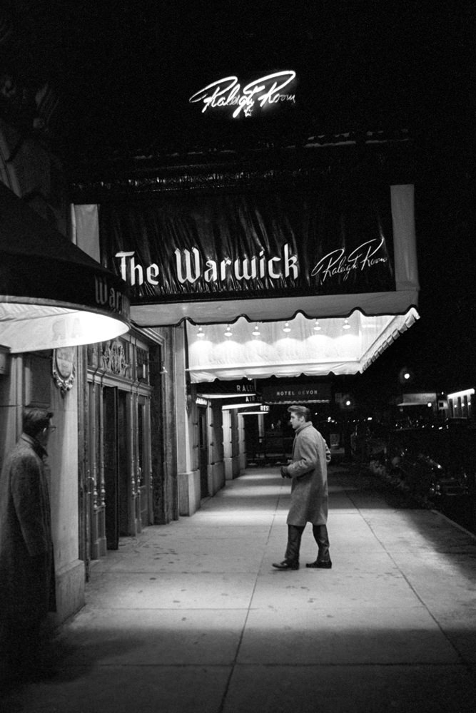 Elvis walking into The Warwick Hotel in New York, 1956.