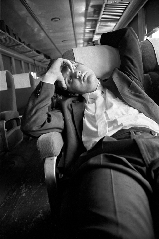 Elvis asleep on the train journey back home to Memphis, 1956.