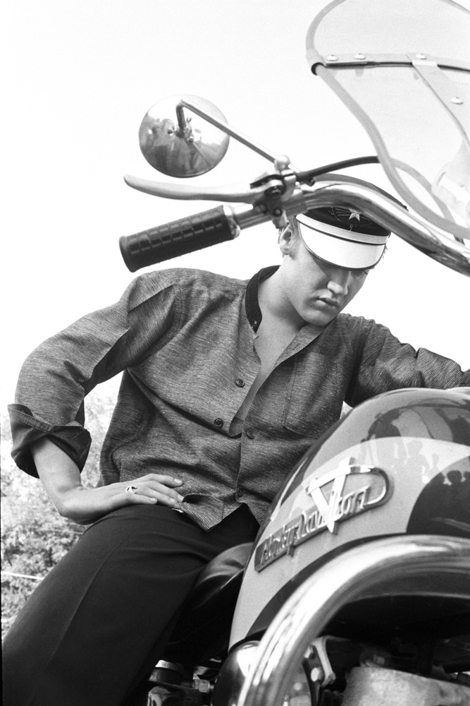 Elvis behind his home at 1034 Auburn Drive, Memphis, 1956.