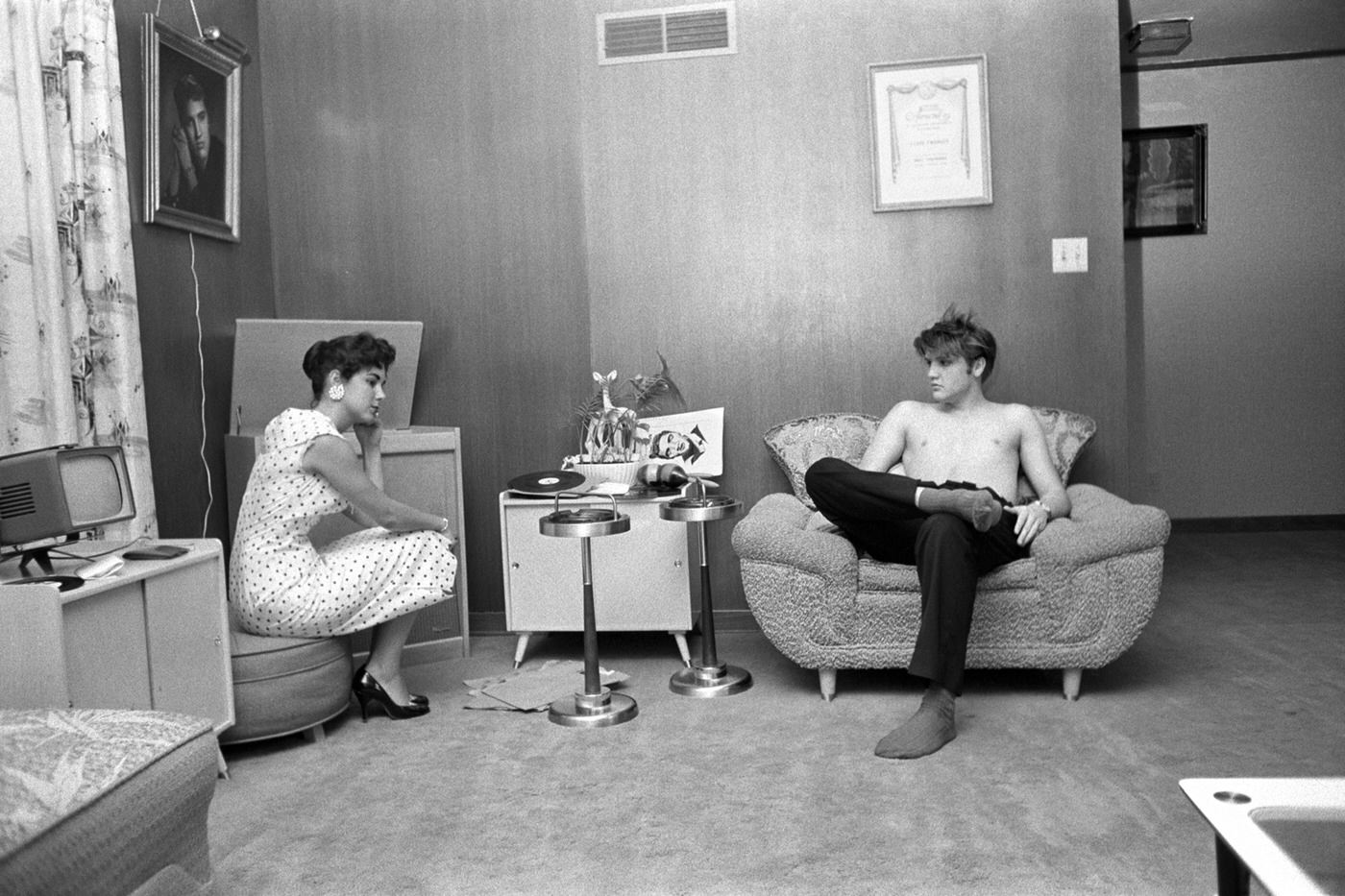 Elvis with Barbara Hearn listening to playback at his home in Memphis, 1956.