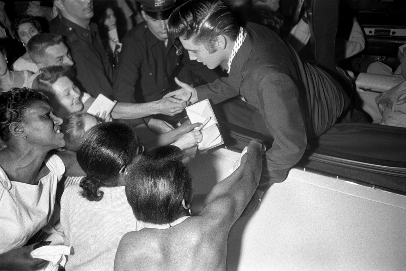 Elvis leaving the Hudson Theatre after performing on the Steve Allen show, New York, 1956.