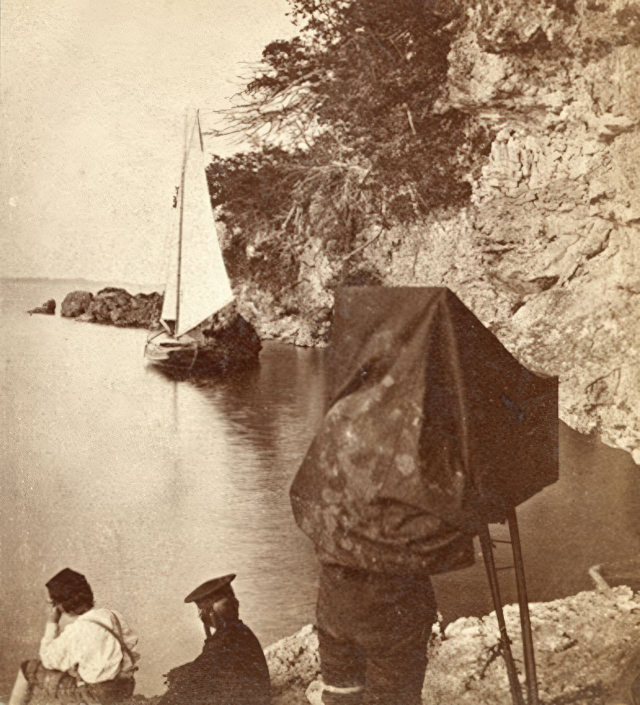 This is half of a stereo card that is marked "Horace D. Udall, Landscape Photographer". We can assume that the man inside the darktent is Horace or his assistant. The location is not marked but the printer of the label on the back is identified as the Cleveland Foundry.