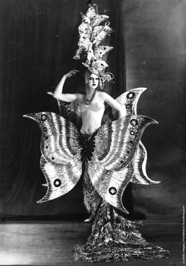 A cabaret dancer in a butterfly costume at the Folies Bergere, Paris, 1910.
