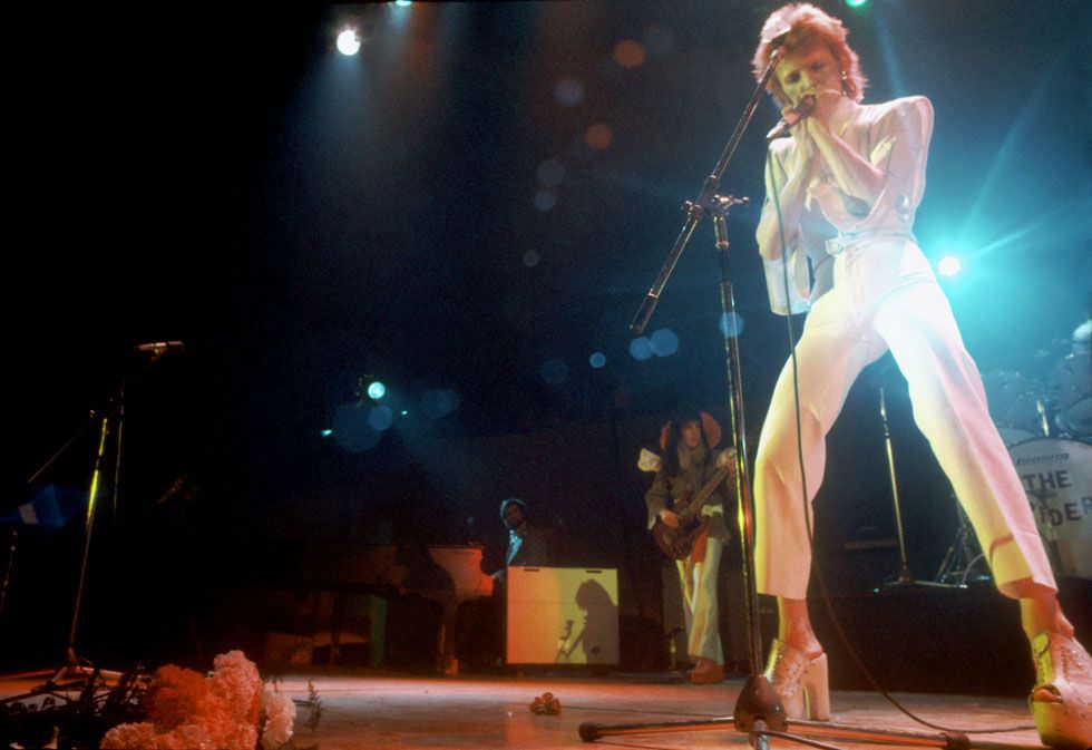 David Bowie in an all-white look performing in Los Angeles, 1973.