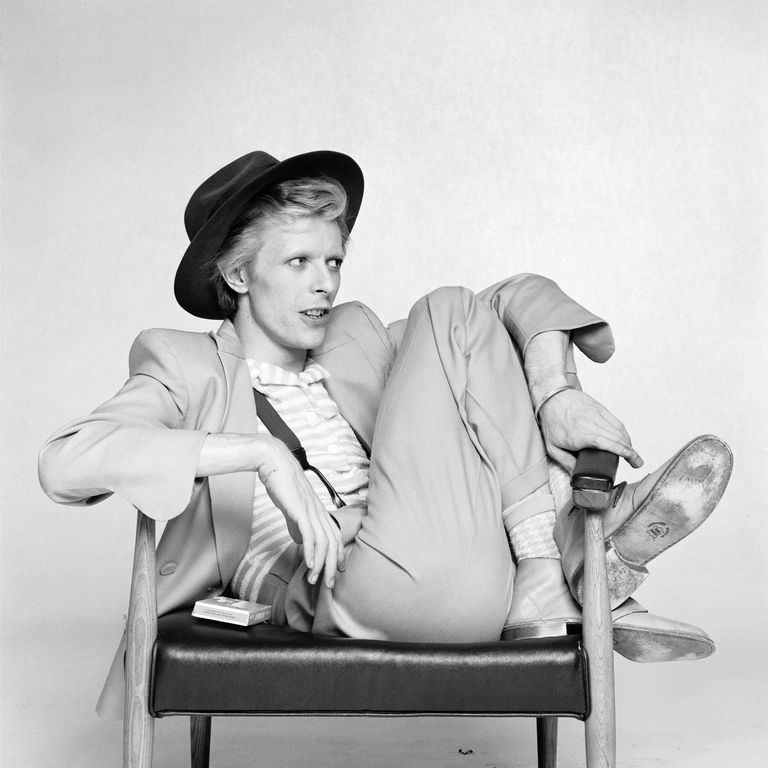 David Bowie in a suit and wide-brim hat for a promo photo, 1974.