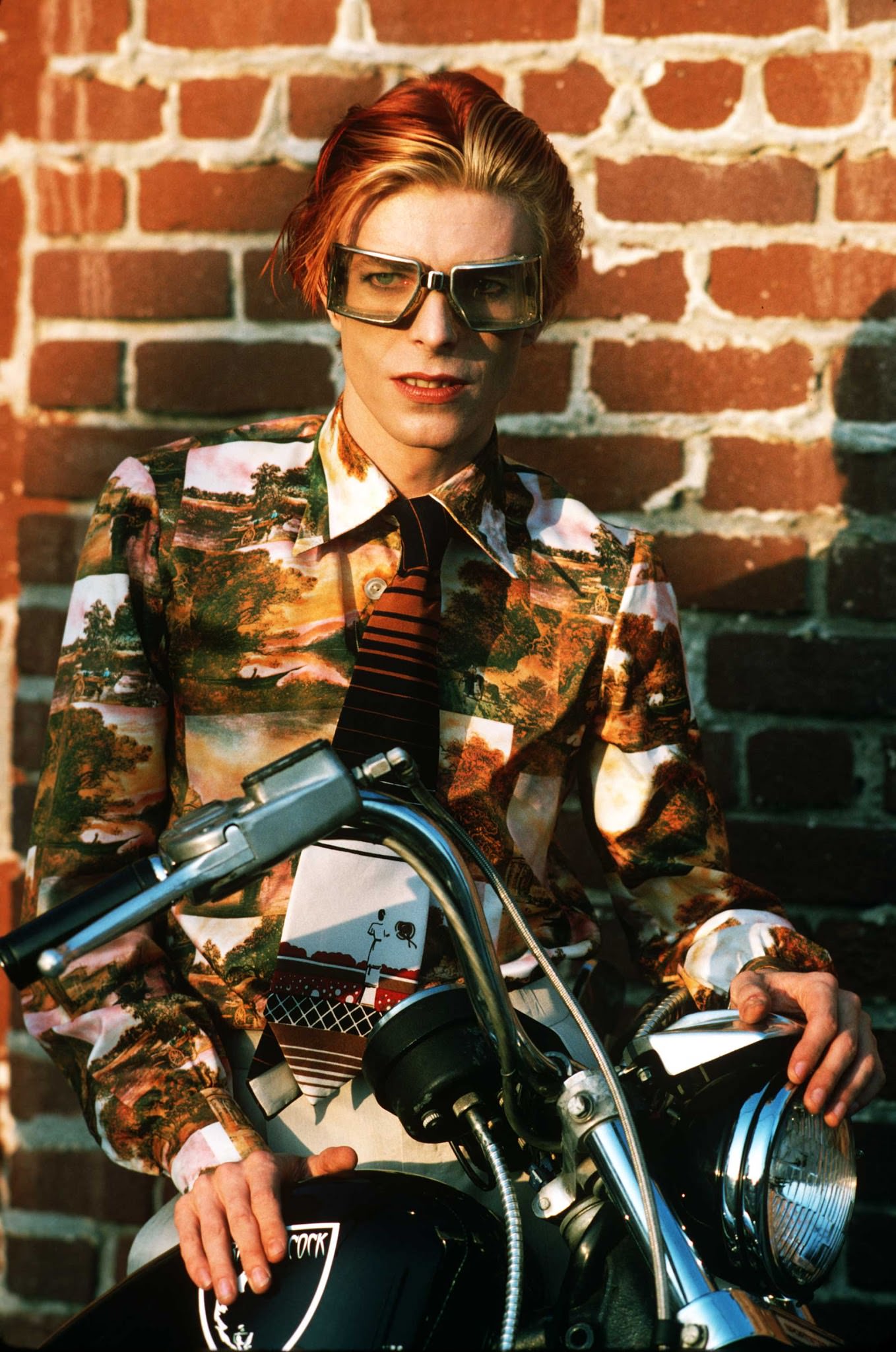 David Bowie with goggles and bike in Los Angeles, 1974.