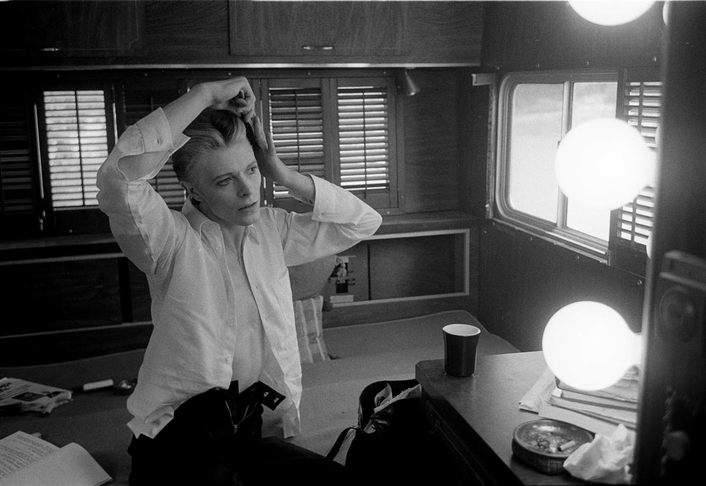 David Bowie combing his hair on the set of The Man Who Fell to Earth, New Mexico, 1975.