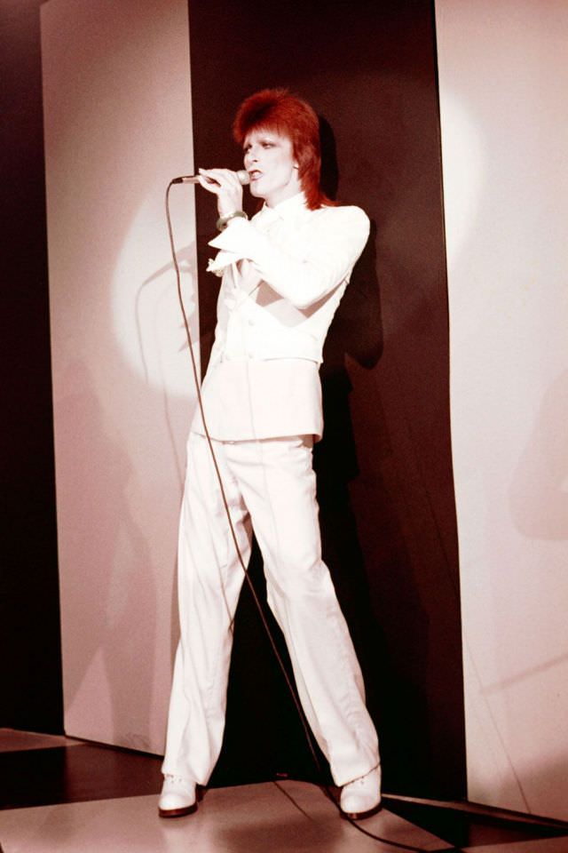 David Bowie in all-white performing at The Marquee Club in London, 1973.