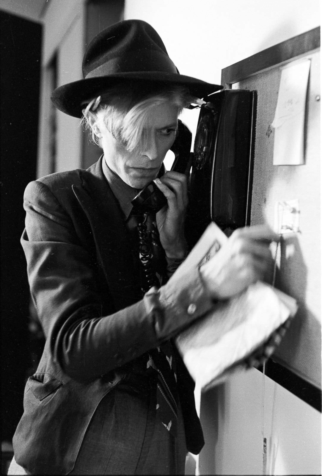 David Bowie in character on the telephone in Los Angeles, 1974.