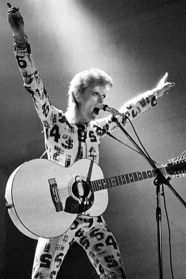 David Bowie in a number-printed jumpsuit on his Stardust tour, 1973.