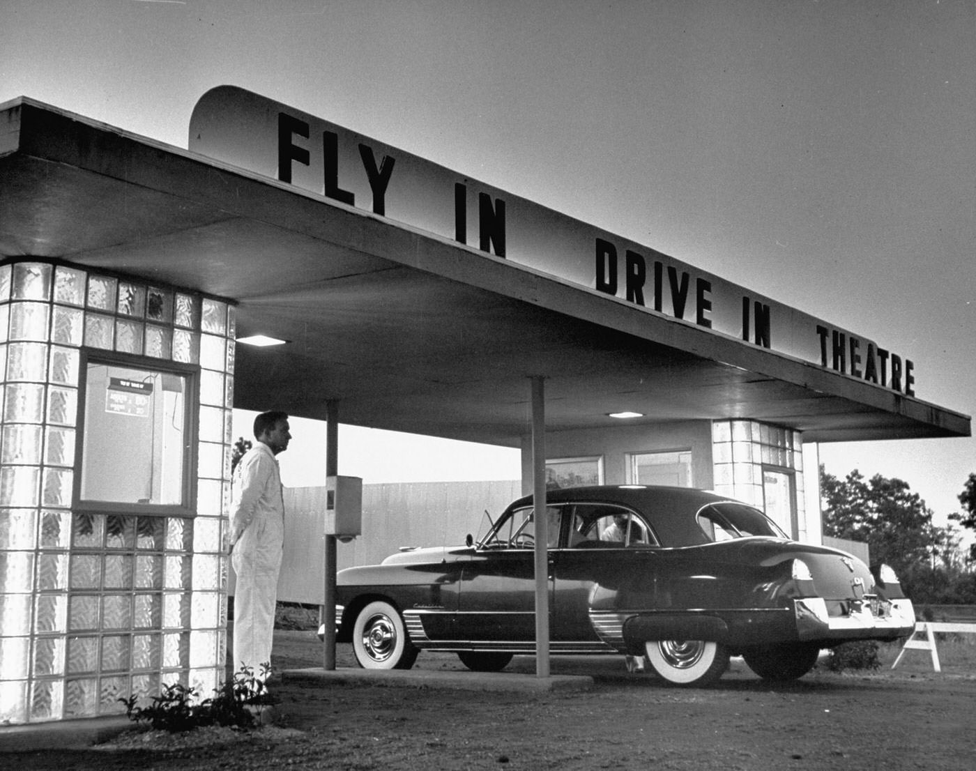 Customers arriving by car at a 'fly-in drive-in' theater, New Jersey, 1949