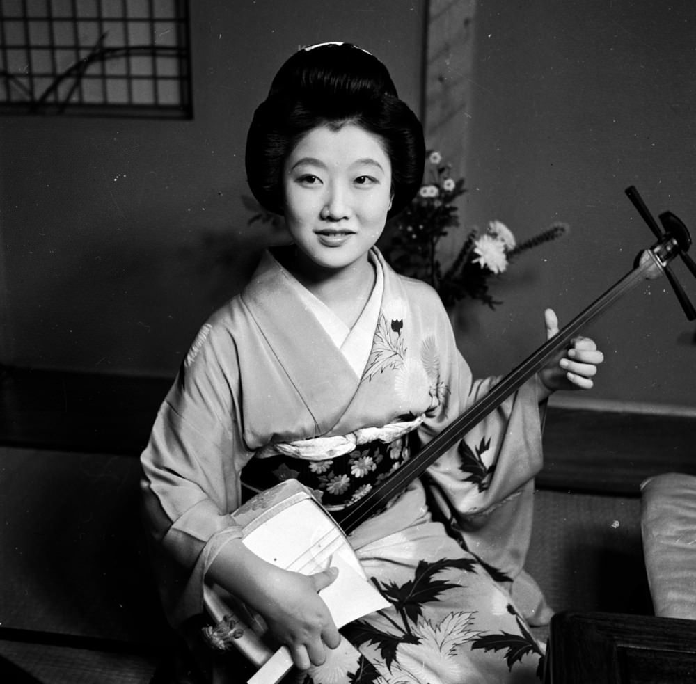 A Japanese Geisha with her samisen, 1950s.