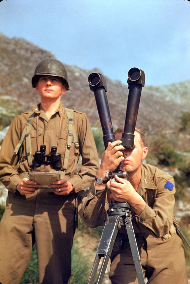 An American soldier scouting German positions during the Allied drive towards Rome, 1944.