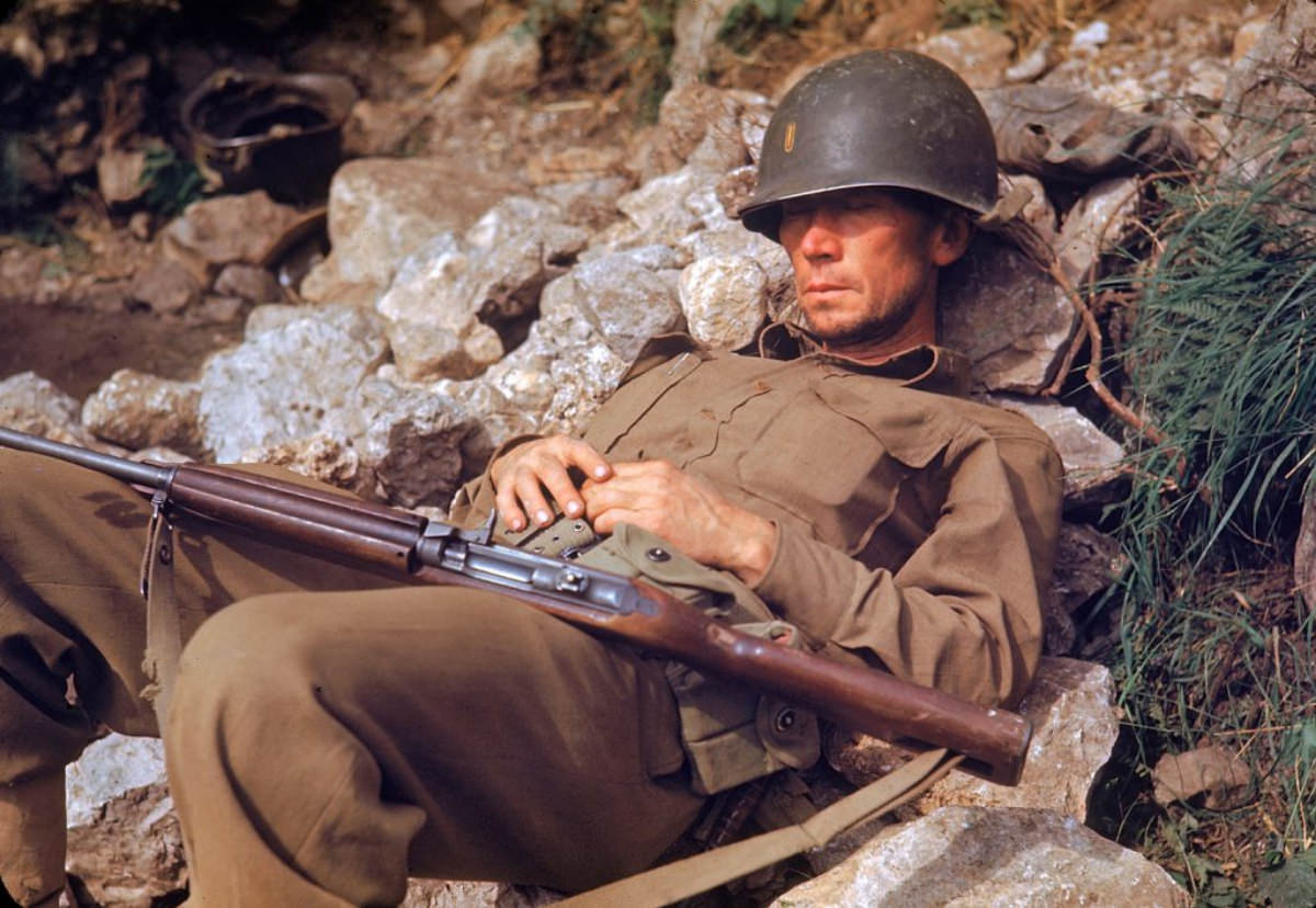 An American soldier sleeping on rocks during the drive towards Rome, 1944.