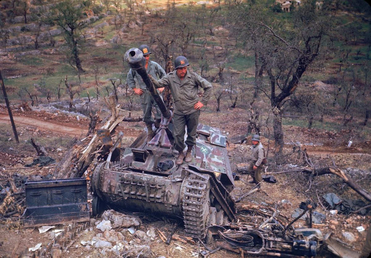 American troops surveying destroyed German armor during the drive towards Rome, 1944.