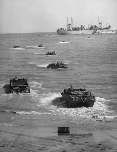 Amphibious trucks ferrying supplies to Anzio beach, 1944.