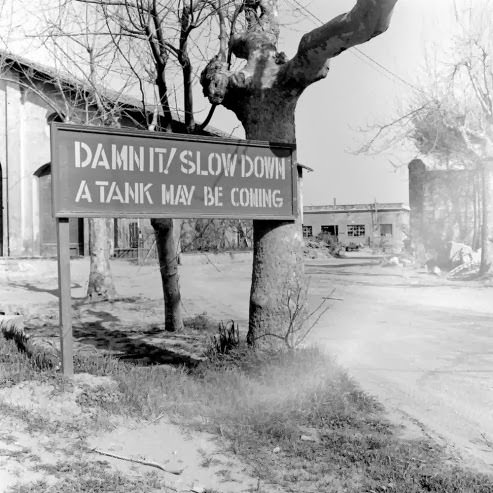 A sign at an intersection in the American sector during the Battle of Anzio, 1944.