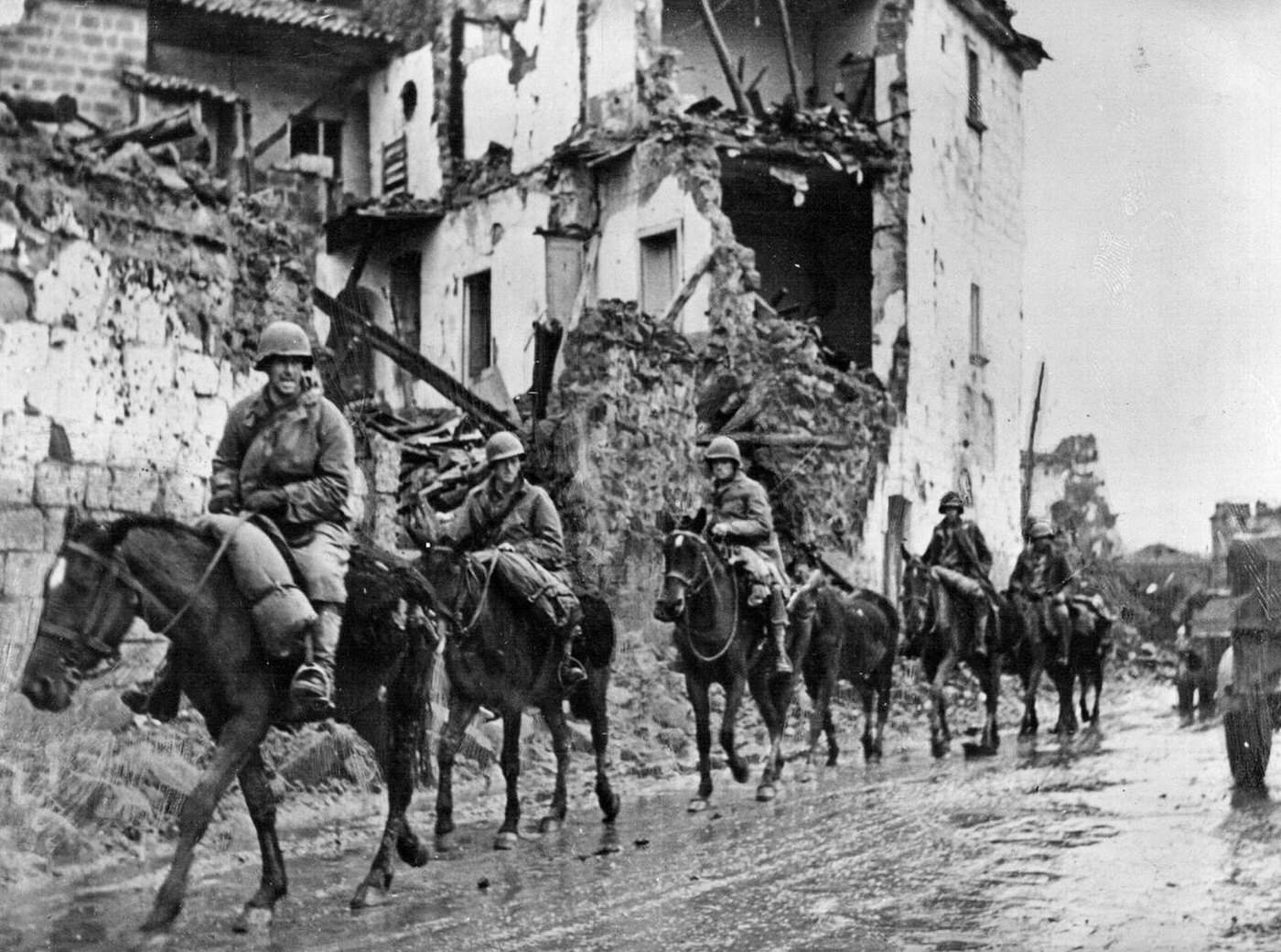 A U.S. cavalry detachment passing through an Italian town, 1943.