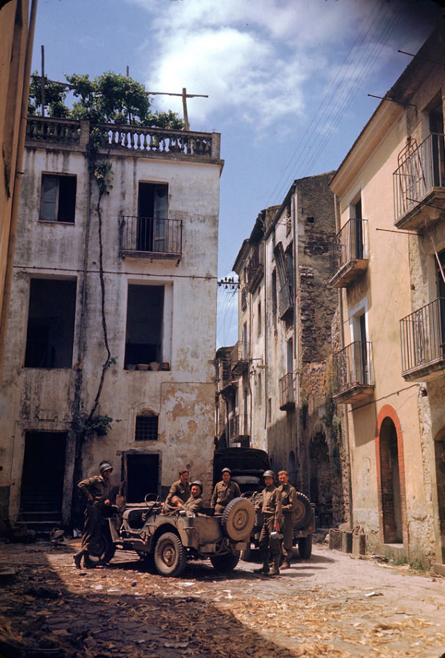 American soldiers rested in a courtyard during the drive towards Rome, World War II, 1940s.