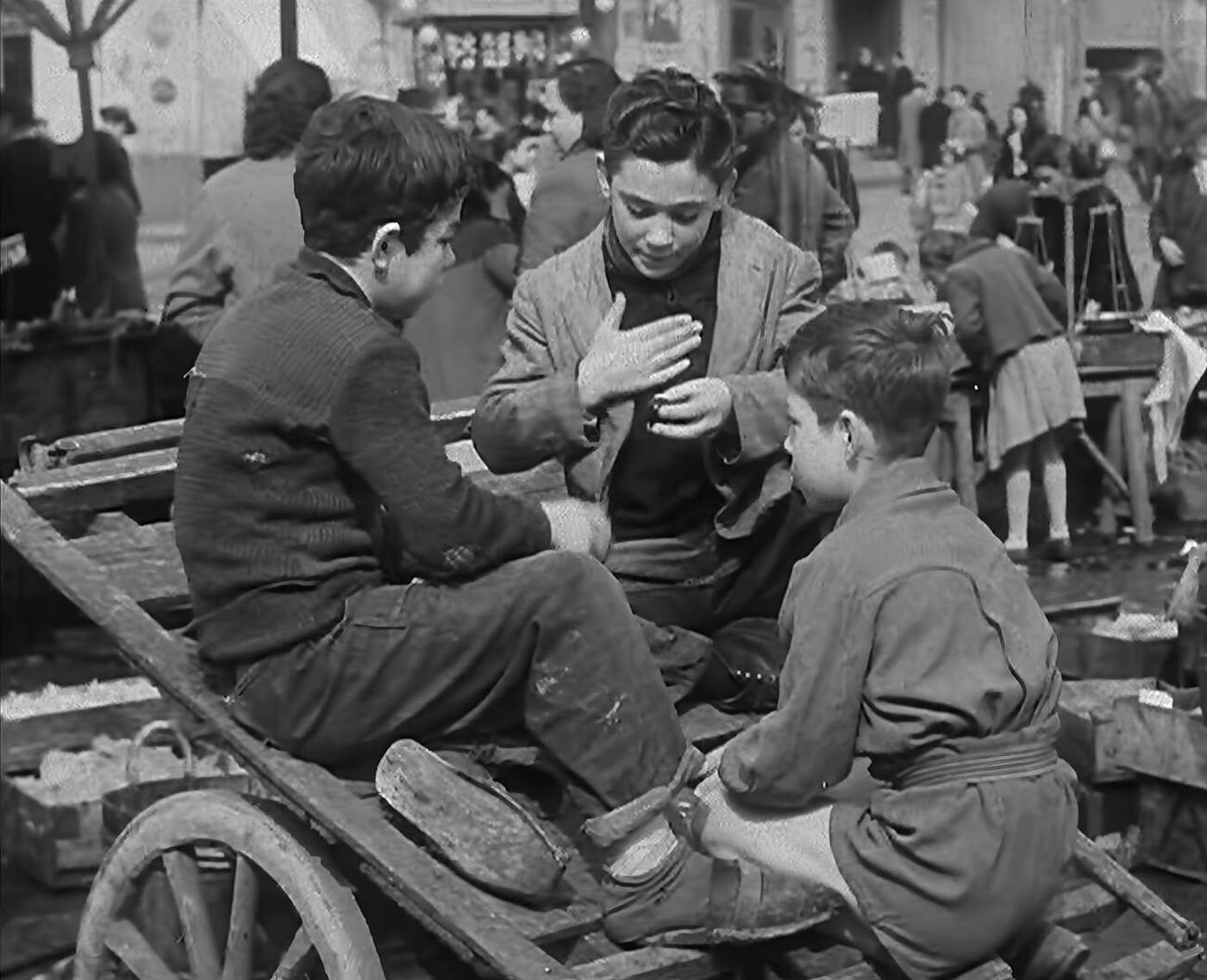 Italian boys talking with civilians, 1944.