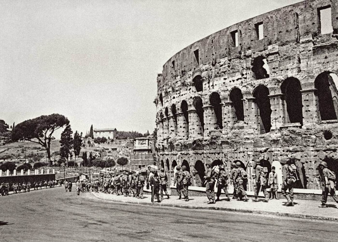 American soldiers passing the Roman Coliseum, 1944.