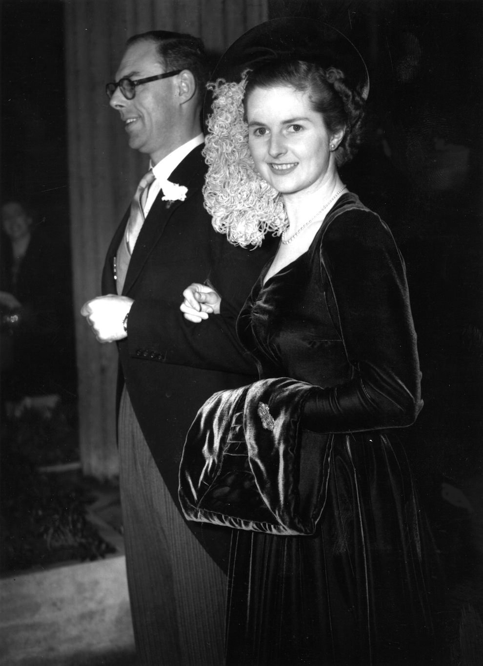 Aged 26. On her wedding day to Denis Thatcher. Wearing a royal blue velvet dress, and a hat was trimmed with ostrich feathers.