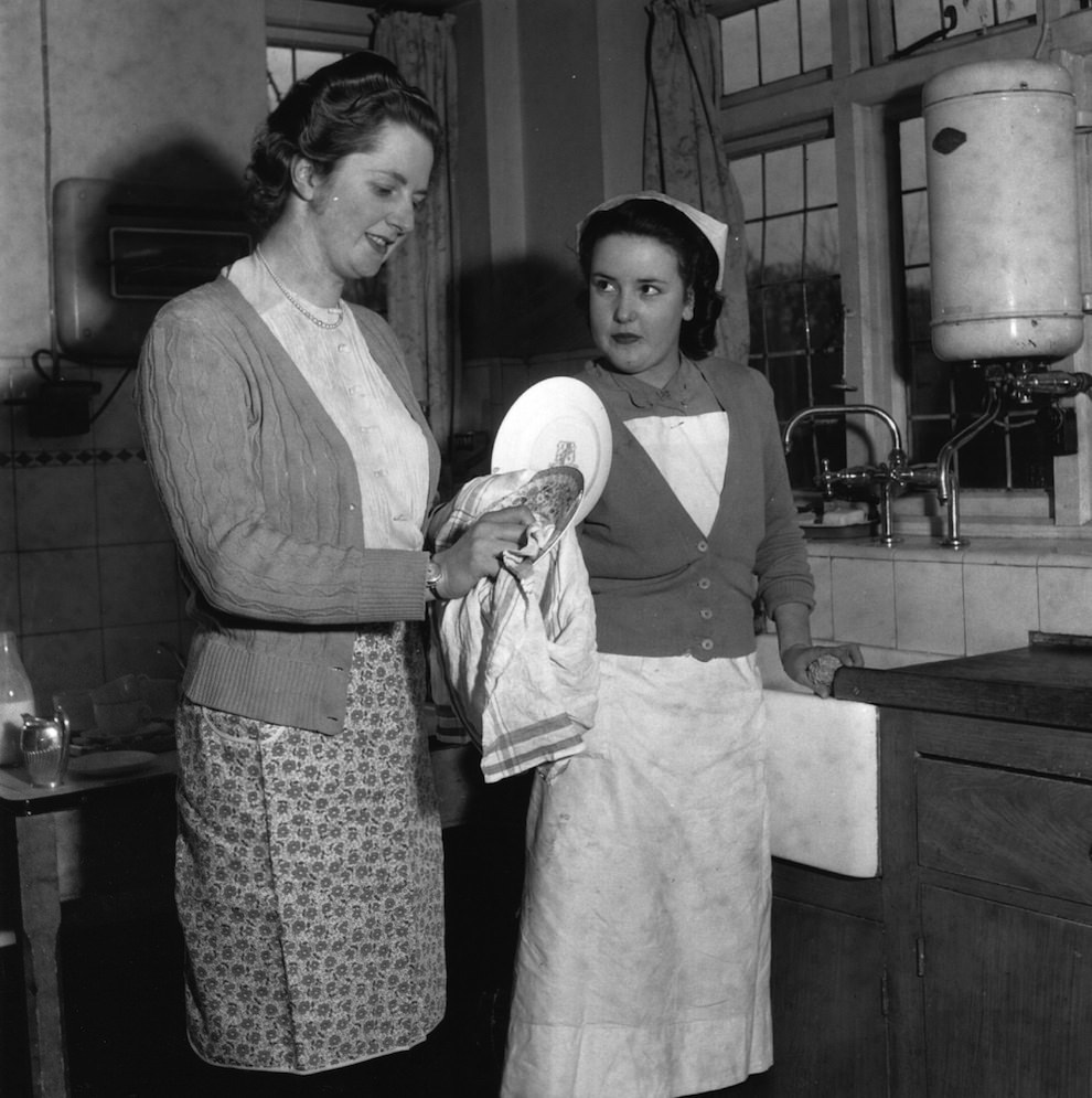 Aged 25. Wiping dishes.