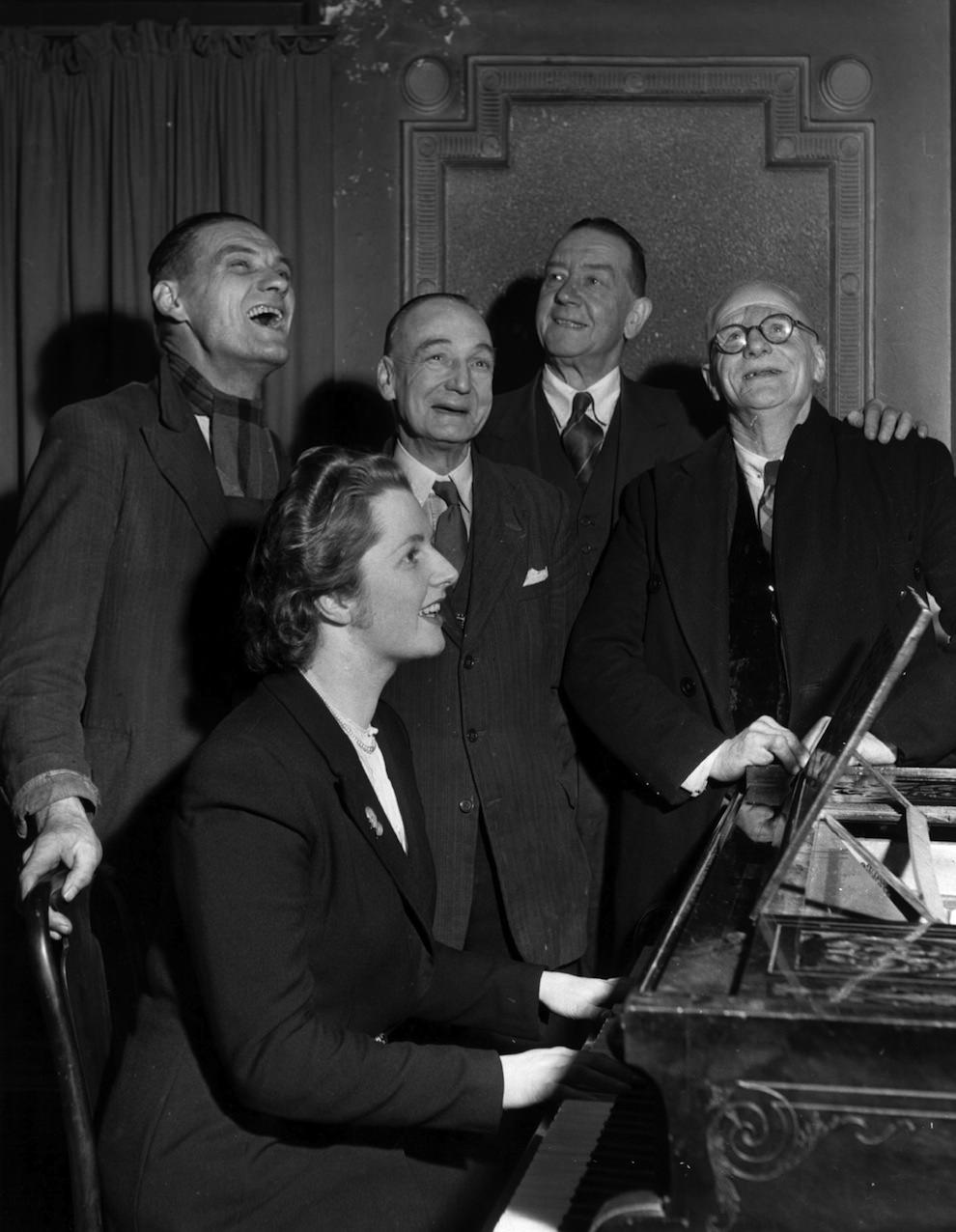 Aged 25. Accompanying four voters on the piano at the Bull Inn, Dartford.