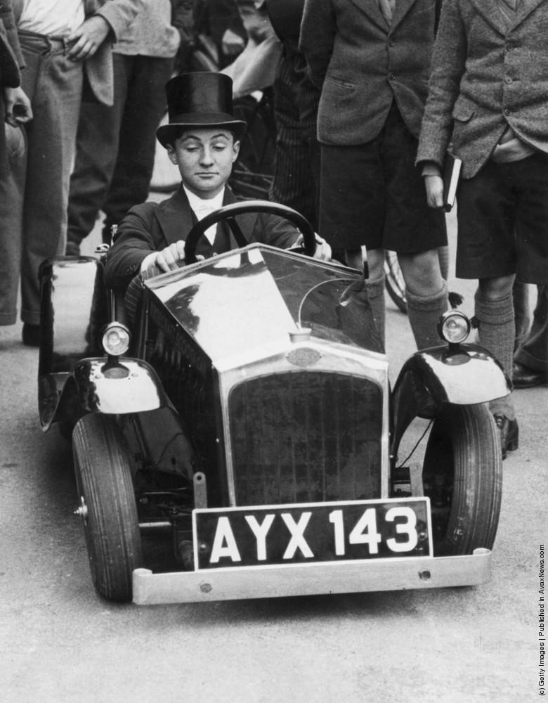 A young Etonian test drives the world's smallest car during a demonstration at Eton College. 31st October 1934.