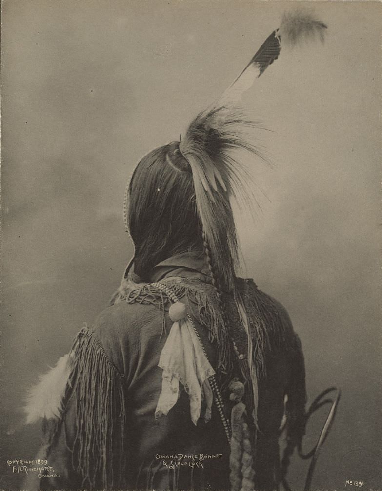 Omaha dance bonnet and scalp lock.