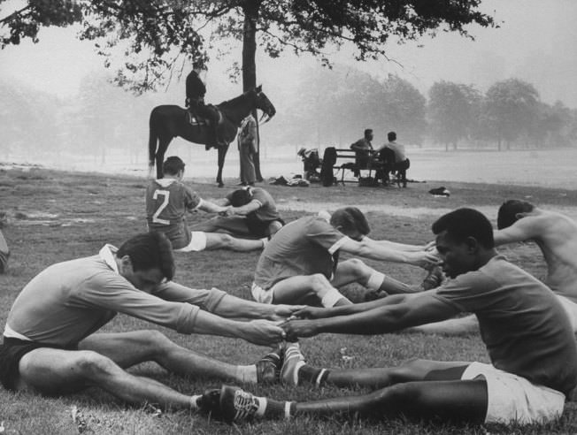 Warming up before a soccer match, Central Park, 1961