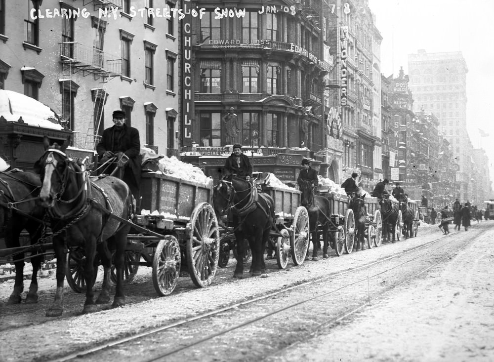 Cleaning snow from New York City streets in trucks, January 1908.
