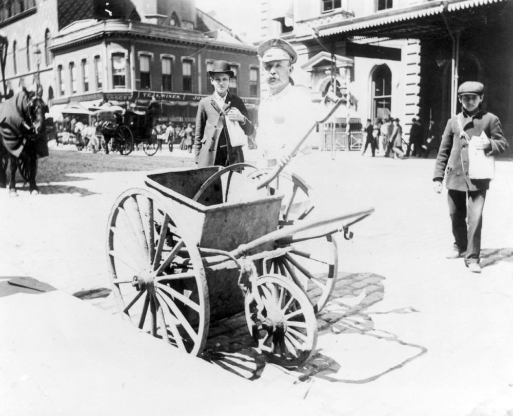 Street sweeper and handcart, New York City, 1896.