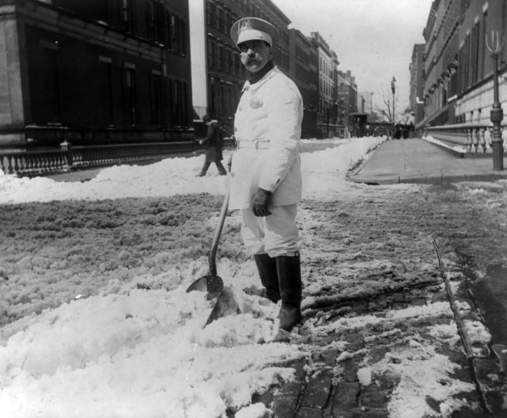 Street cleaner shoveling snow, New York City, 1896.