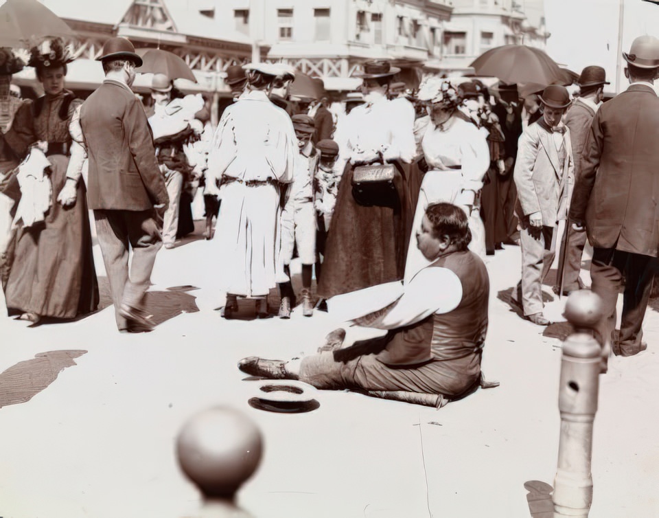 Beggar among the crowd on Surf Avenue, Coney Island, ca 1896.