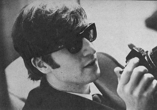 John Lennon and his camera.