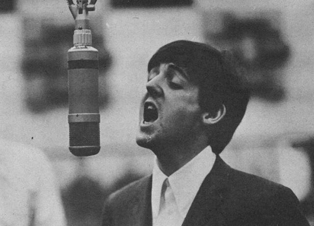 Paul McCartney singing passionately.