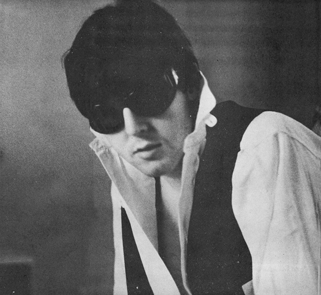 Paul McCartney wearing dark glasses.